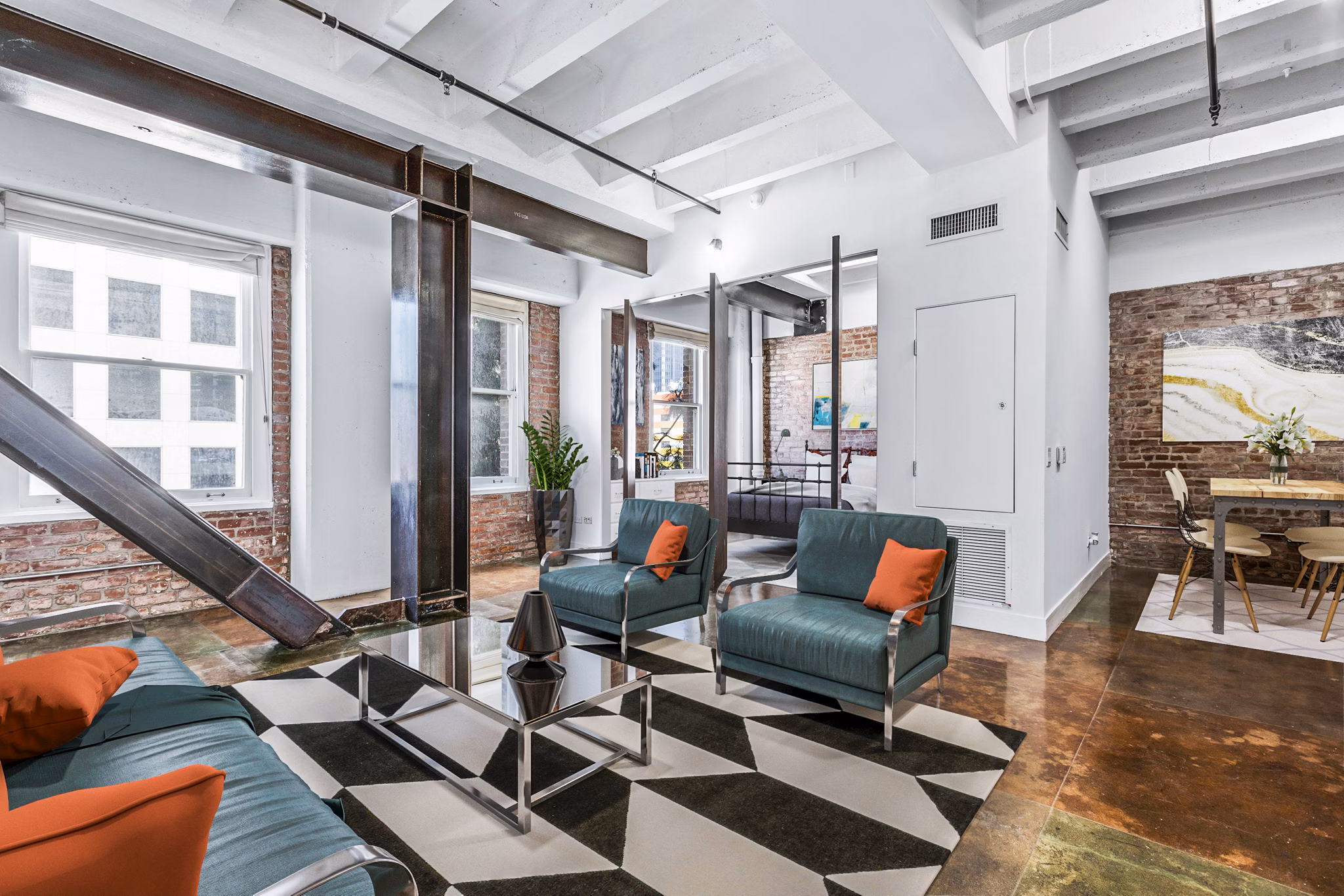 Spacious living room with stylish decor and natural light in South Park Lofts Apartments