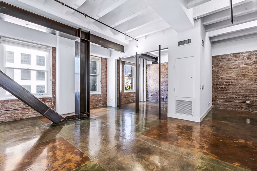 Bright living room with industrial decor at South Park Lofts Apartments