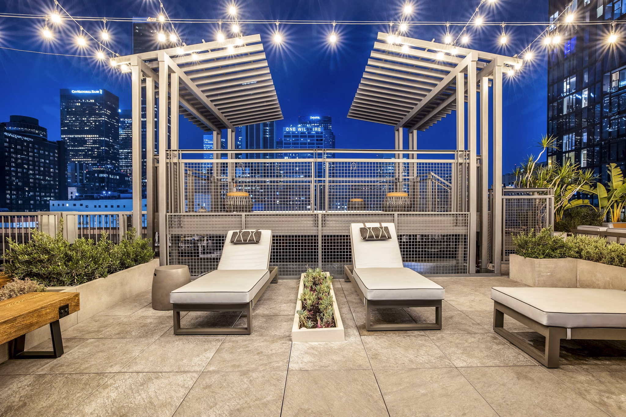 Private patio balcony with outdoor seating at South Park Lofts Apartments offering relaxing views and luxury living amenities