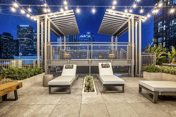 Private patio balcony with outdoor seating at South Park Lofts Apartments offering relaxing views and luxury living amenities