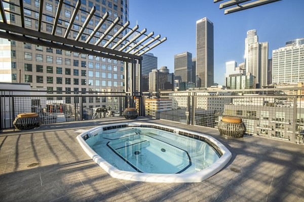 Rooftop pool with skyline views at South Park Lofts Apartments