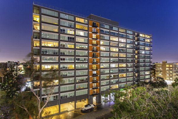 High-rise apartment building illuminated at night at The View Apartments