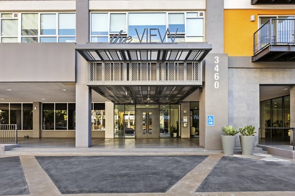 Apartment building entrance with "The View" sign and address 3460 at The View Apartments