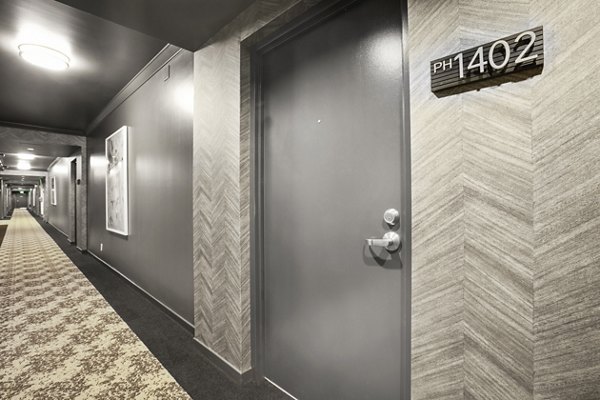 Hallway with door labeled PH 1402 and patterned walls at The View Apartments