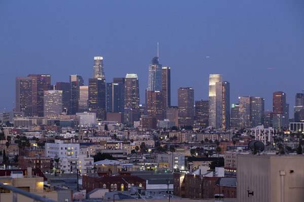 The View Apartments: Los Angeles skyline at dusk with illuminated buildings, luxury living experience