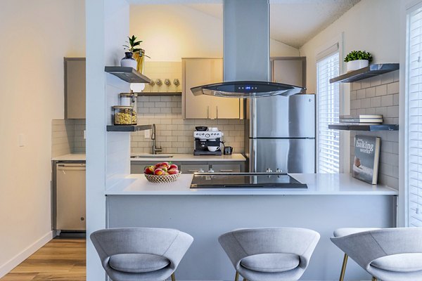 Modern kitchen with stainless steel appliances at Larkspur West Linn Apartments