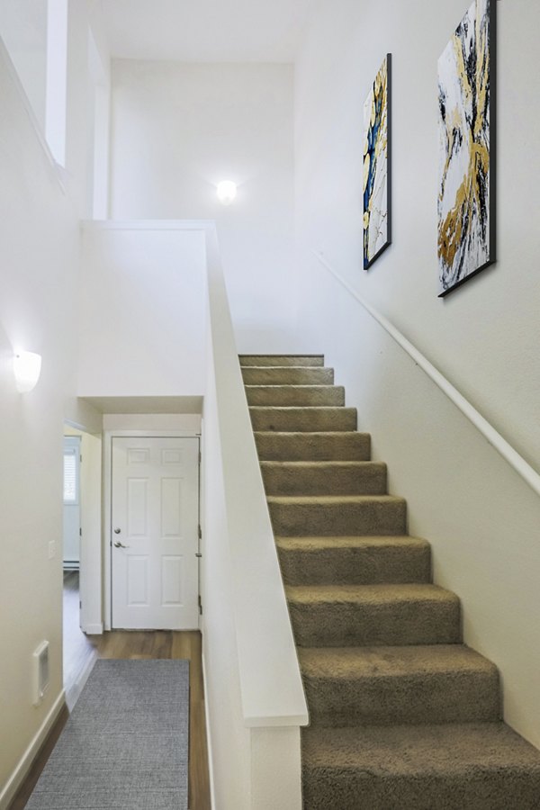 Larkspur West Linn Apartments: Elegant stairway with modern design elements in luxury apartment building