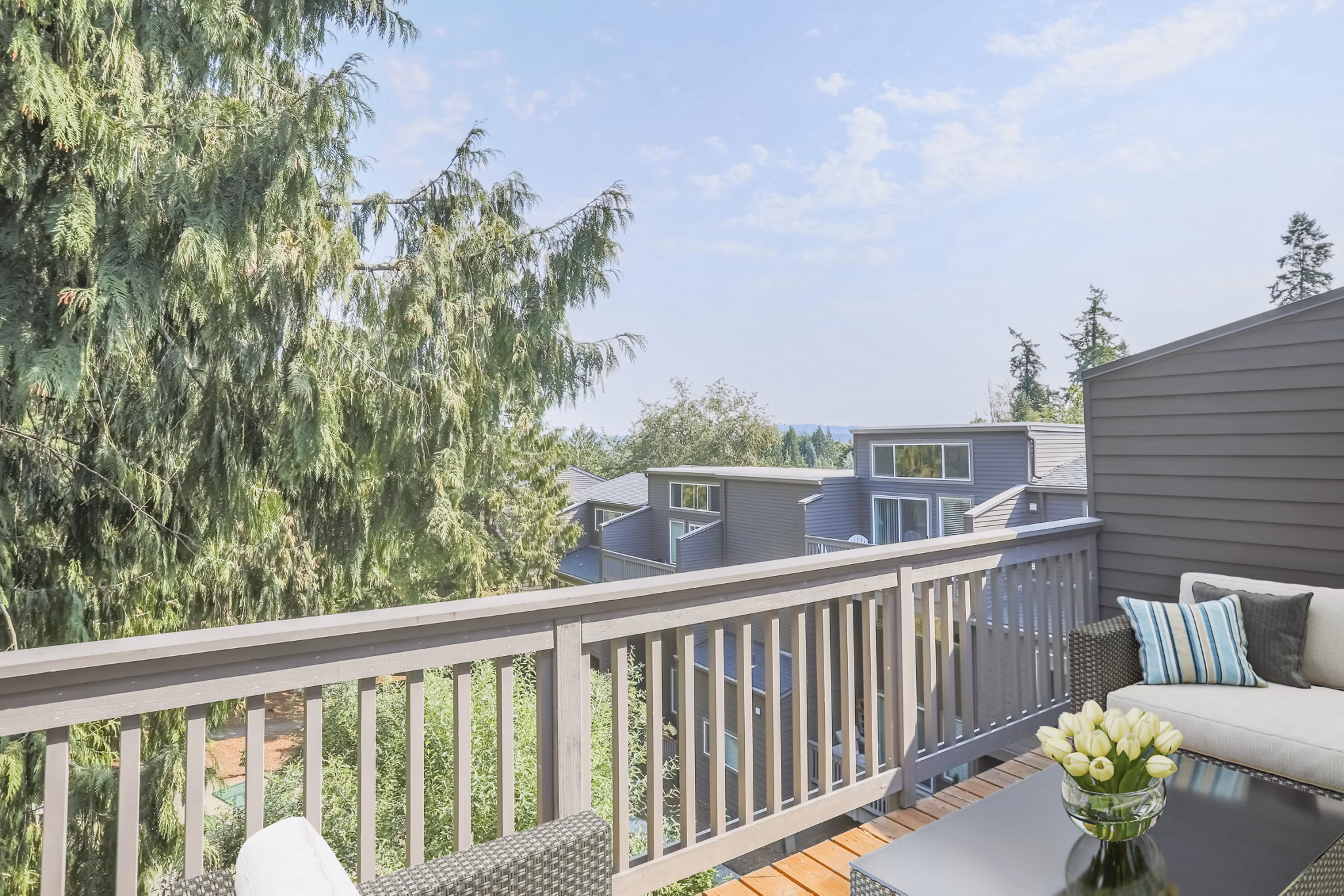 Private patio with scenic views at Larkspur West Linn Apartments, perfect for relaxing outdoors