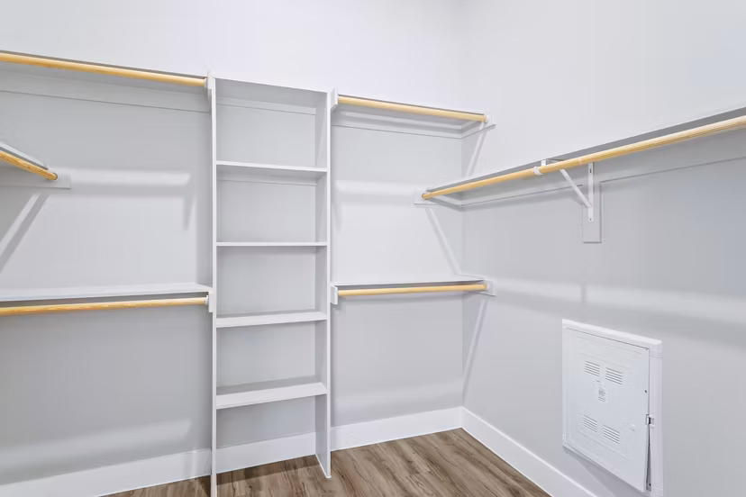 Organized closet space with ample shelving in The Gin Mill Apartments, highlighting luxury living options in Greystar properties