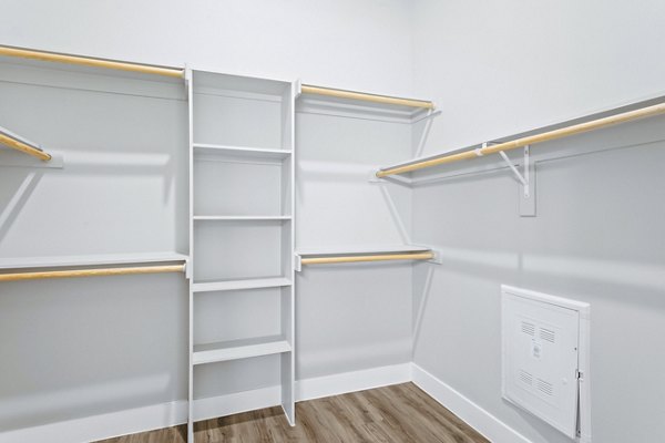 Organized closet space with ample shelving in The Gin Mill Apartments, highlighting luxury living options in Greystar properties