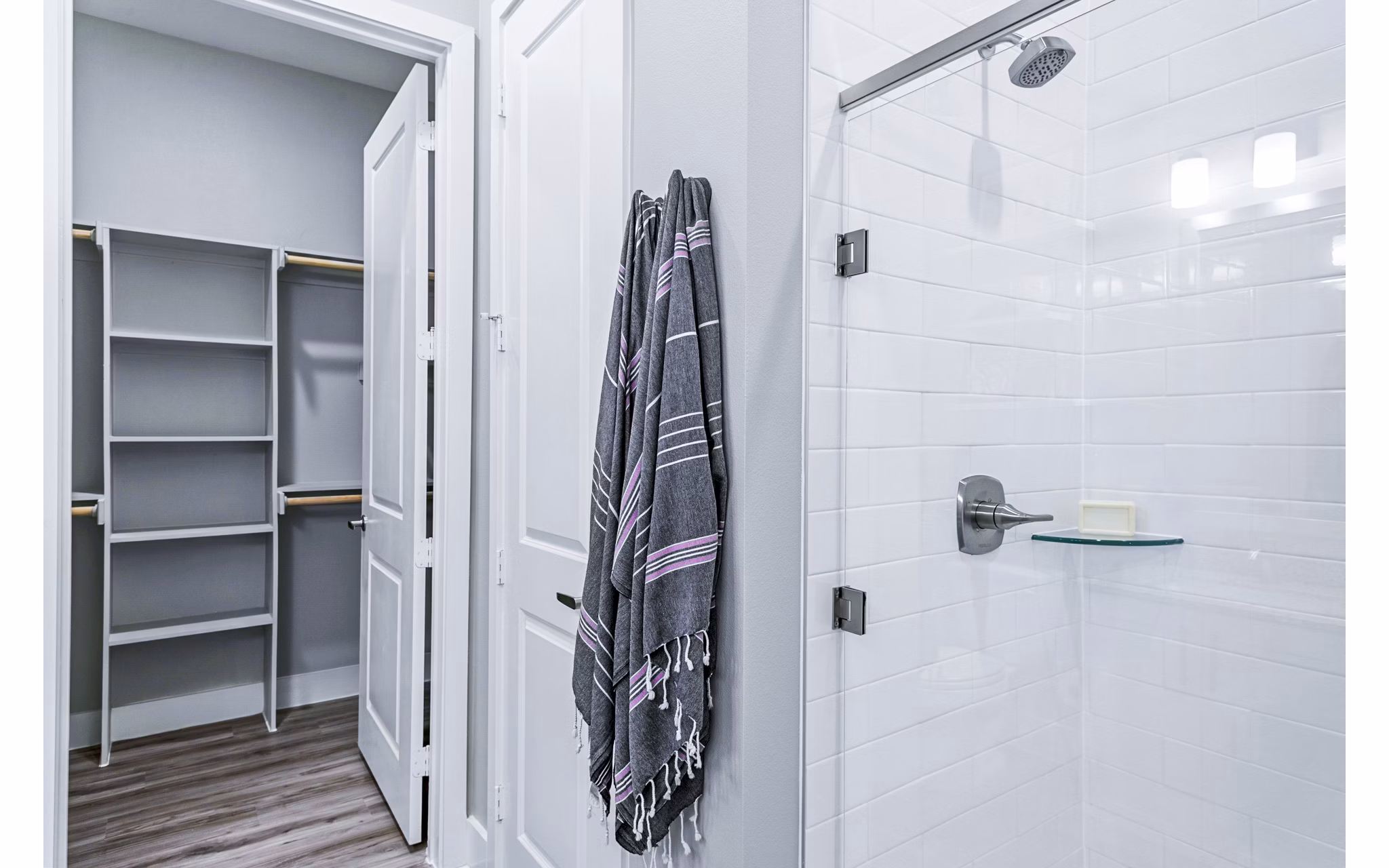 Luxurious bathroom with marble countertops and modern fixtures at The Gin Mill Apartments