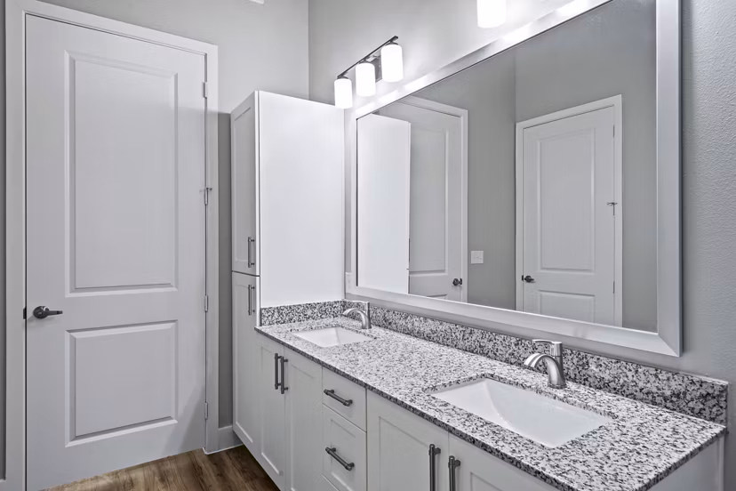 Bathroom featuring modern fixtures and elegant lighting at The Gin Mill Apartments: luxury living spaces
