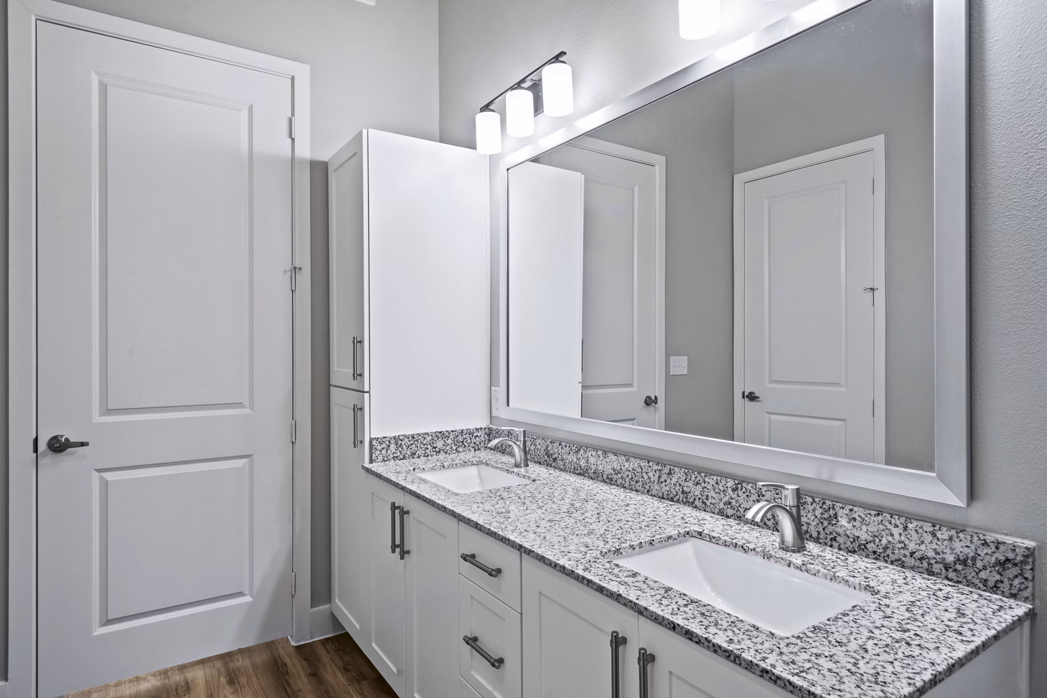 Bathroom featuring modern fixtures and elegant lighting at The Gin Mill Apartments: luxury living spaces
