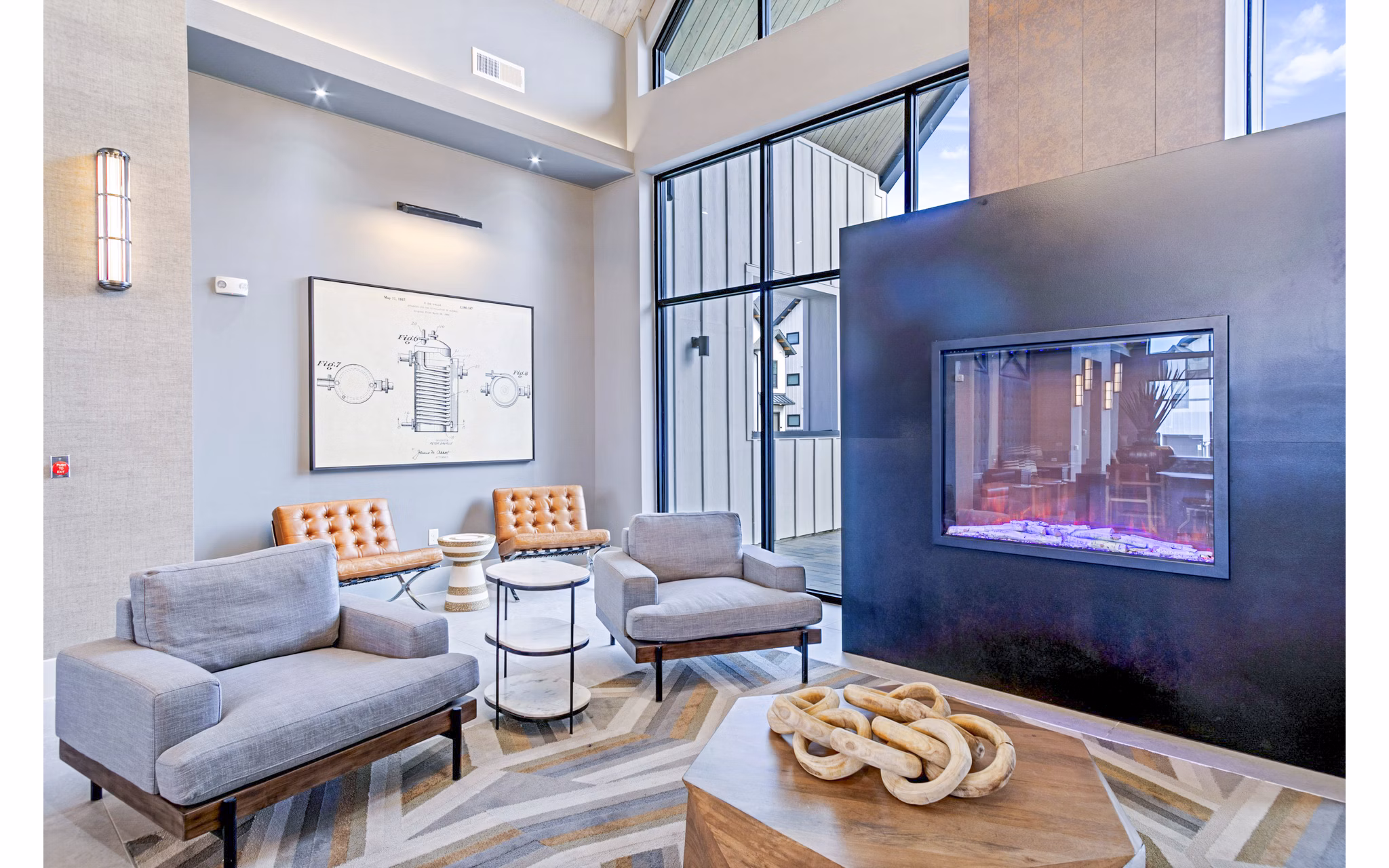 Clubhouse with modern decor and games at The Gin Mill Apartments