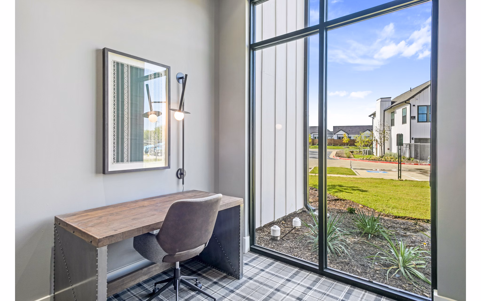 The Gin Mill Apartments: Modern business center and clubhouse with coworking spaces in a luxury apartment community