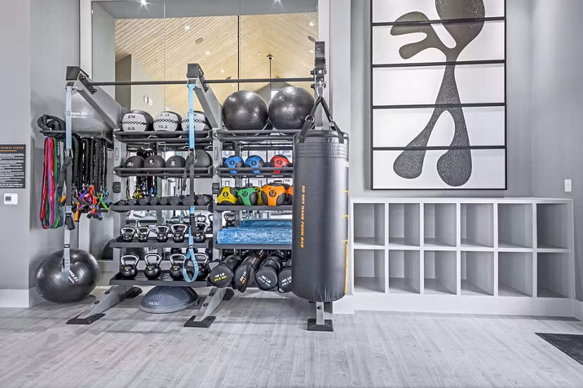 Modern fitness center with state-of-the-art equipment at The Gin Mill Apartments