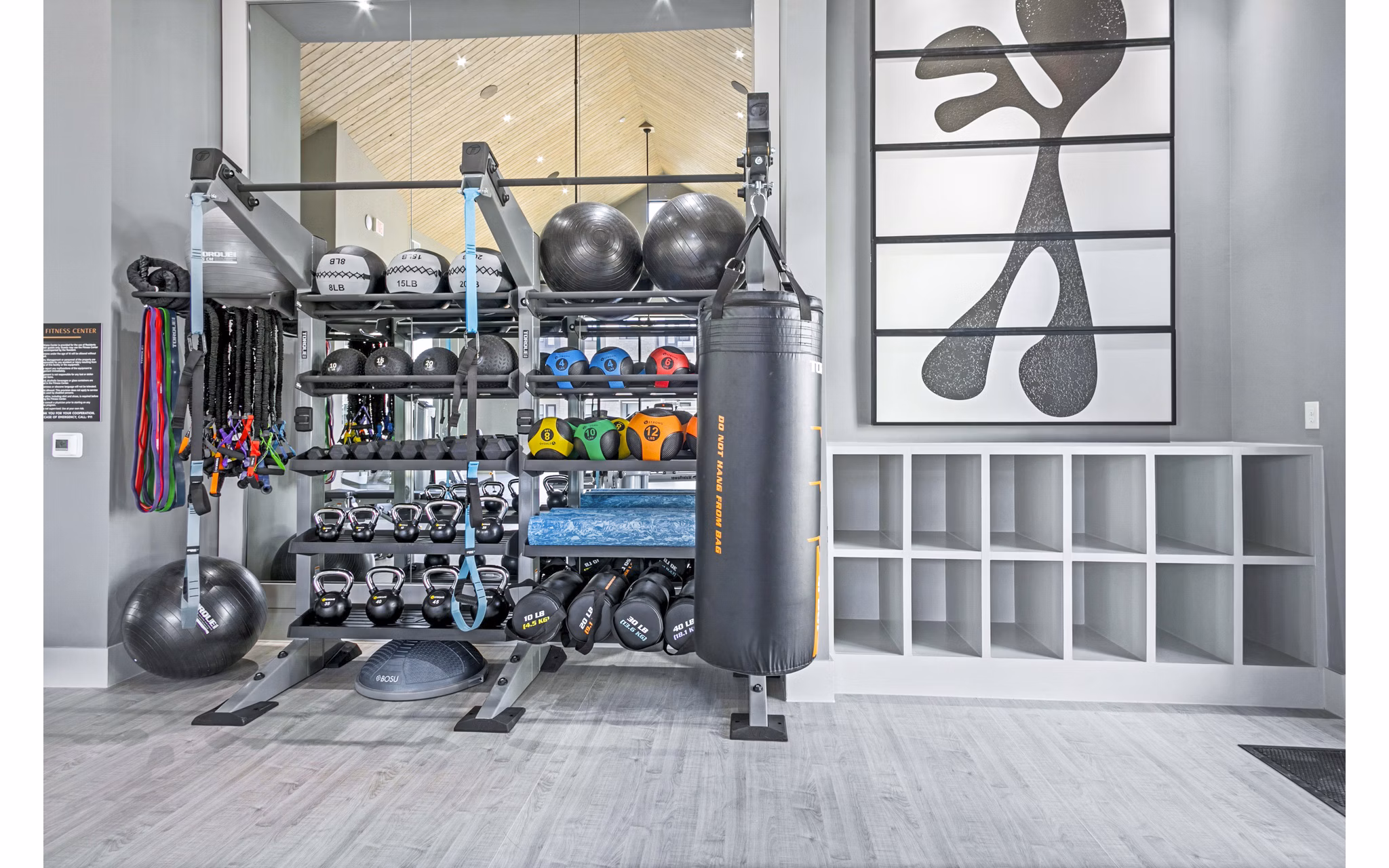 Modern fitness center with state-of-the-art equipment at The Gin Mill Apartments