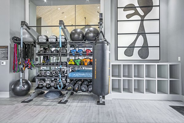 Modern fitness center with state-of-the-art equipment at The Gin Mill Apartments