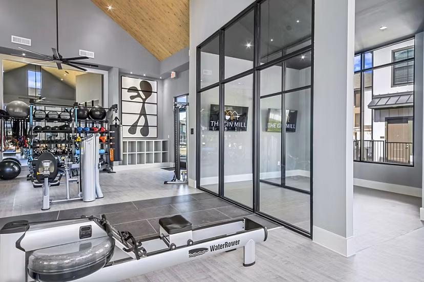 State-of-the-art fitness center with modern equipment at The Gin Mill Apartments, offering a premium workout experience