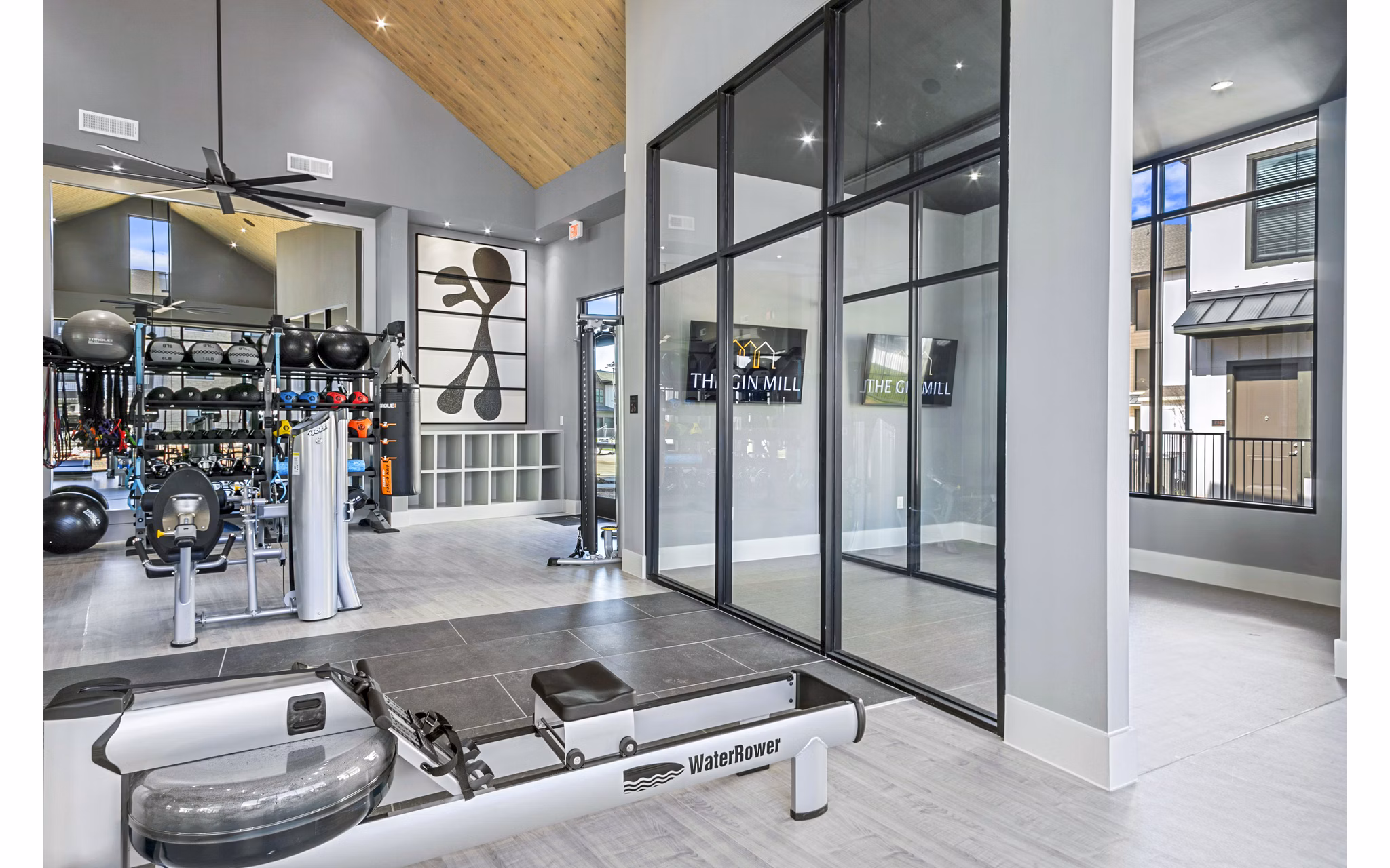 State-of-the-art fitness center with modern equipment at The Gin Mill Apartments, offering a premium workout experience