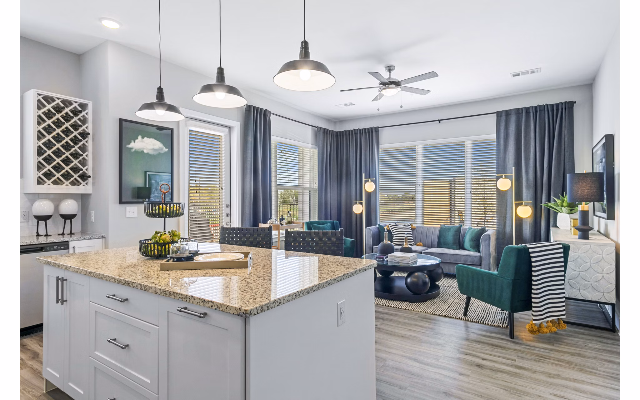 Modern kitchen with stainless steel appliances in The Gin Mill Apartments