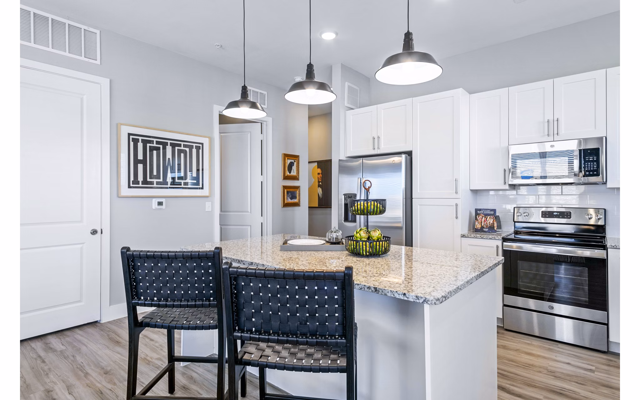Elegant kitchen with modern appliances and sleek countertops at The Gin Mill Apartments, perfect for luxury living in a stylish setting