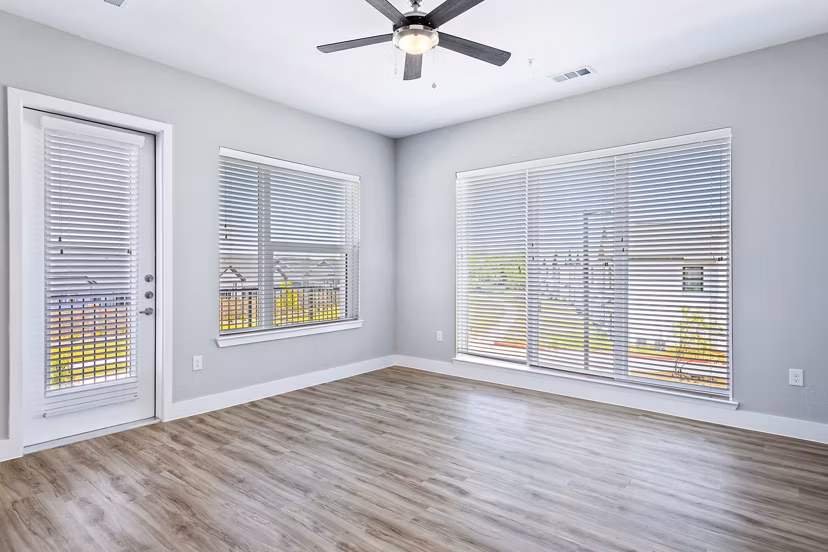 Spacious living room with upscale decor in The Gin Mill Apartments