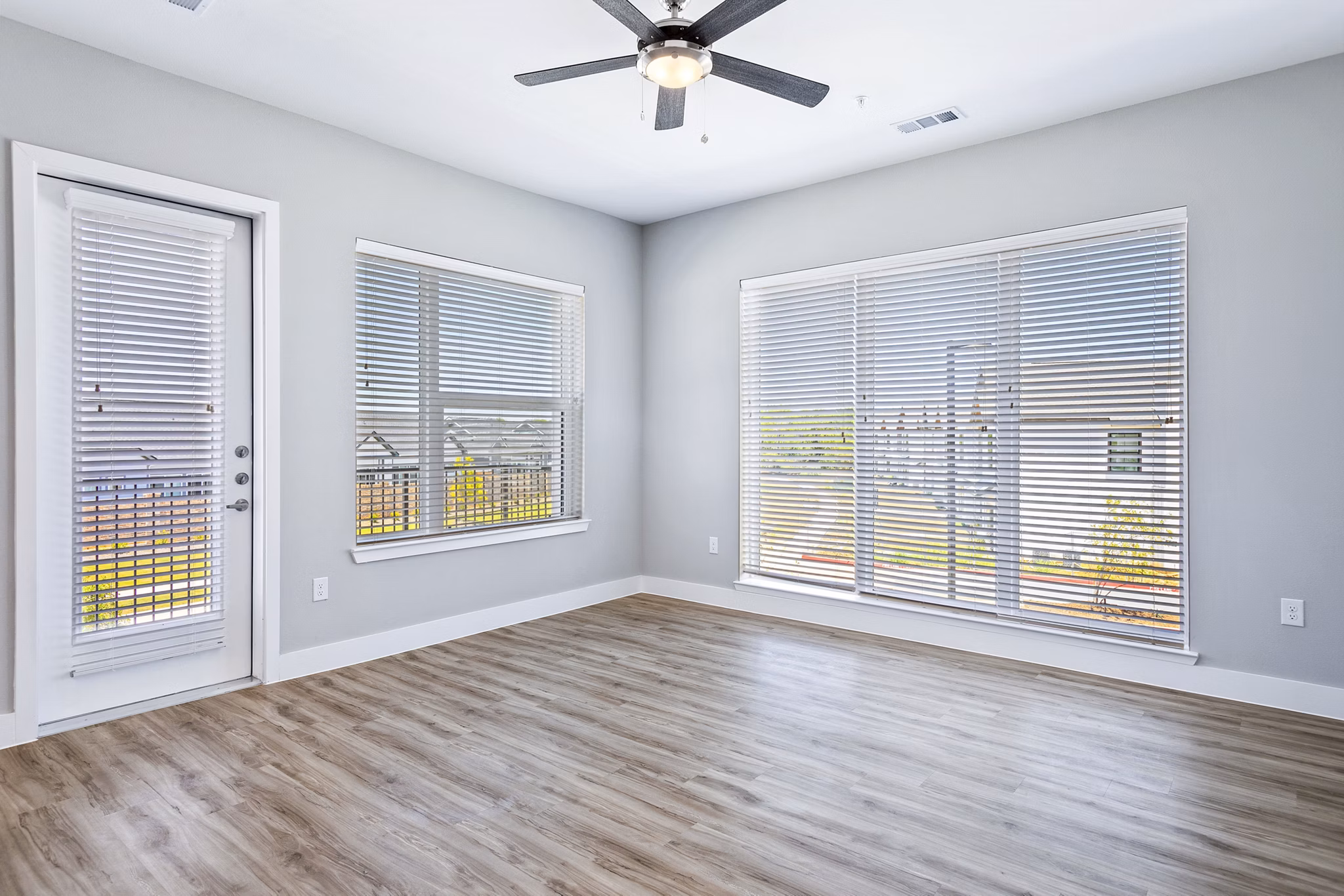 Spacious living room with upscale decor in The Gin Mill Apartments