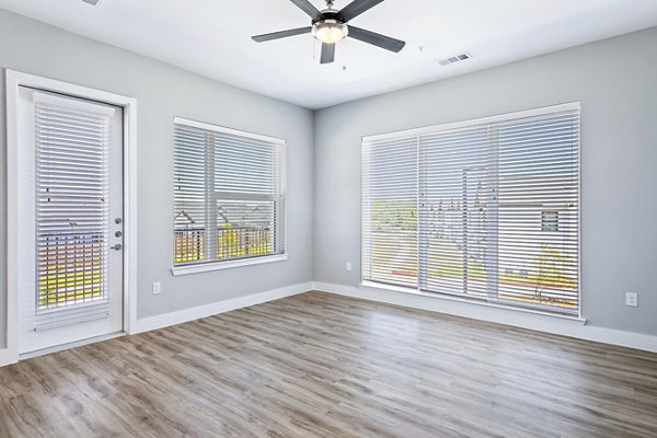 Spacious living room with upscale decor in The Gin Mill Apartments
