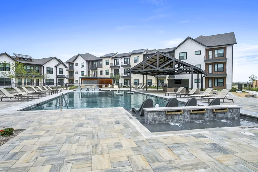 Luxurious pool area at The Gin Mill Apartments, ideal for relaxation and leisure with elegant surroundings and modern design