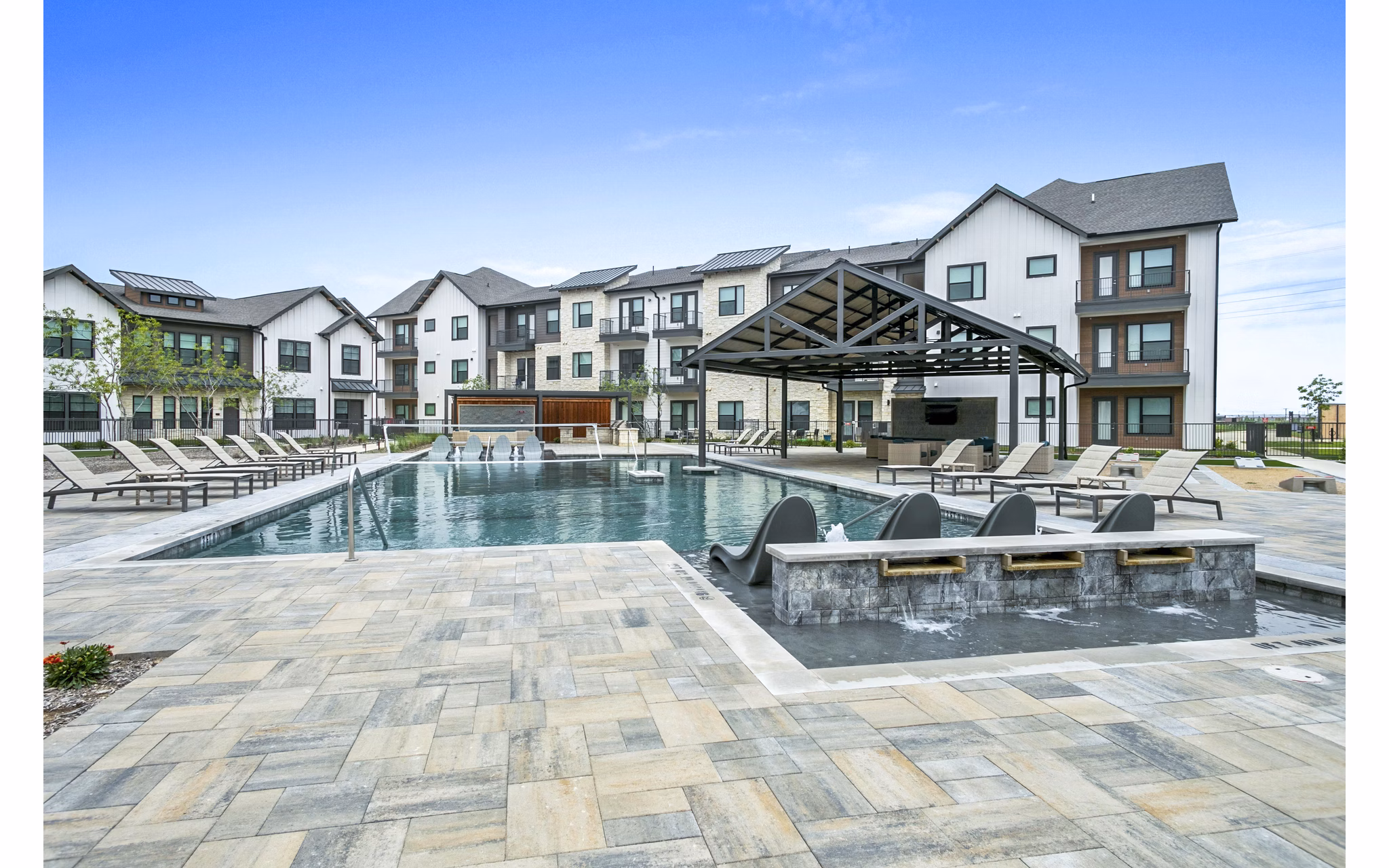 Luxurious pool area at The Gin Mill Apartments, ideal for relaxation and leisure with elegant surroundings and modern design
