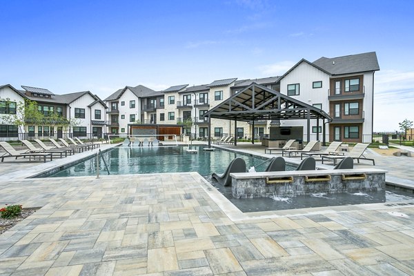 Luxurious pool area at The Gin Mill Apartments, ideal for relaxation and leisure with elegant surroundings and modern design