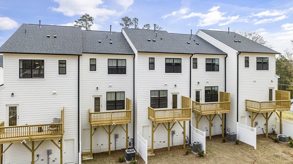 Patio with modern outdoor seating at Abode Kerr Ridge Apartments, offering luxury outdoor living spaces