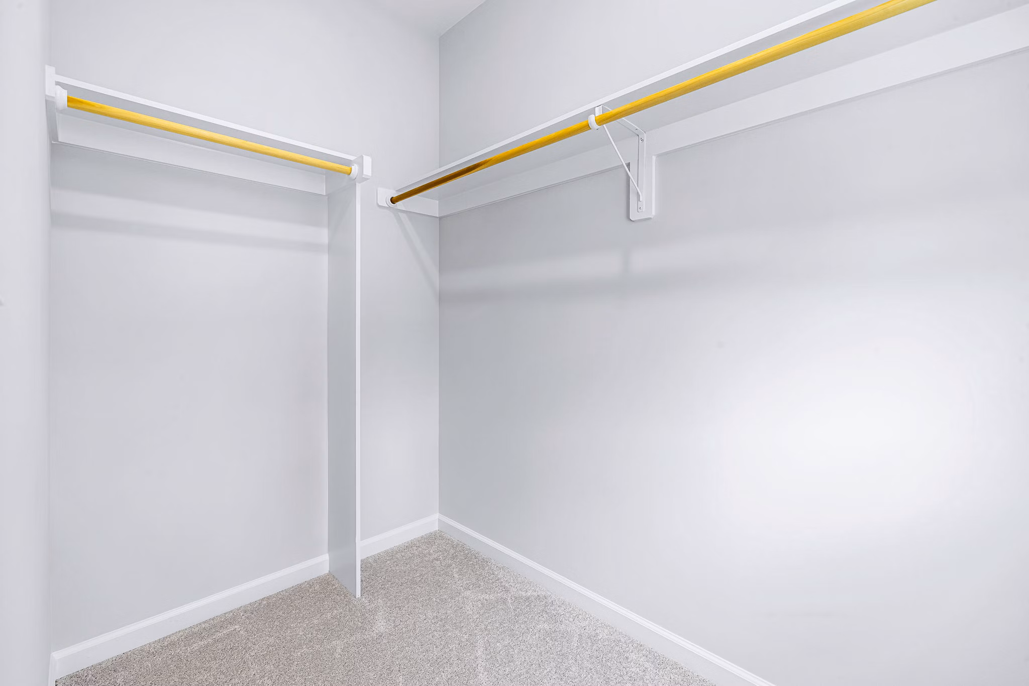 Walk-in closet with ample storage space in a bedroom at Abode Kerr Ridge Apartments