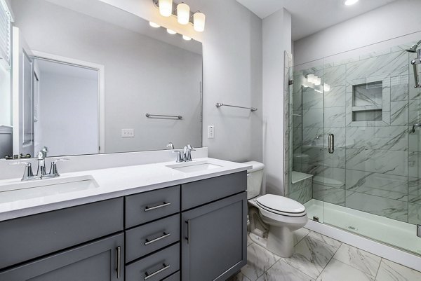 Bathroom featuring modern fixtures at Abode Kerr Ridge Apartments