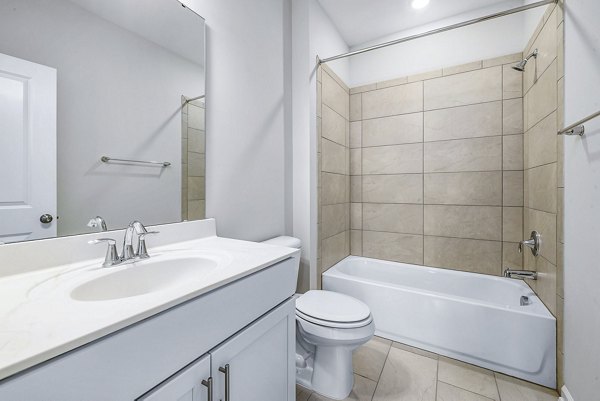 Modern bathroom with sleek fixtures at Abode Kerr Ridge Apartments