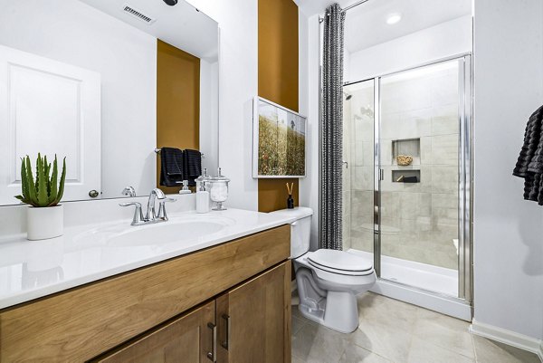 Modern bathroom with sleek fixtures in Abode Kerr Ridge Apartments