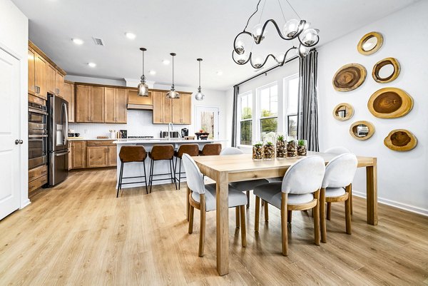 Modern dining room with elegant decor at Abode Kerr Ridge Apartments, a luxury Greystar property