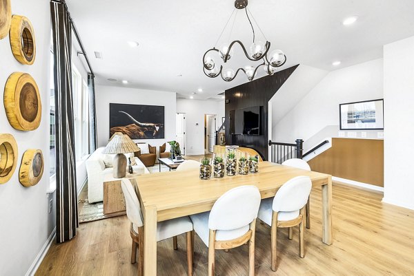 Dining room featuring modern decor and sleek dining set at Abode Kerr Ridge Apartments