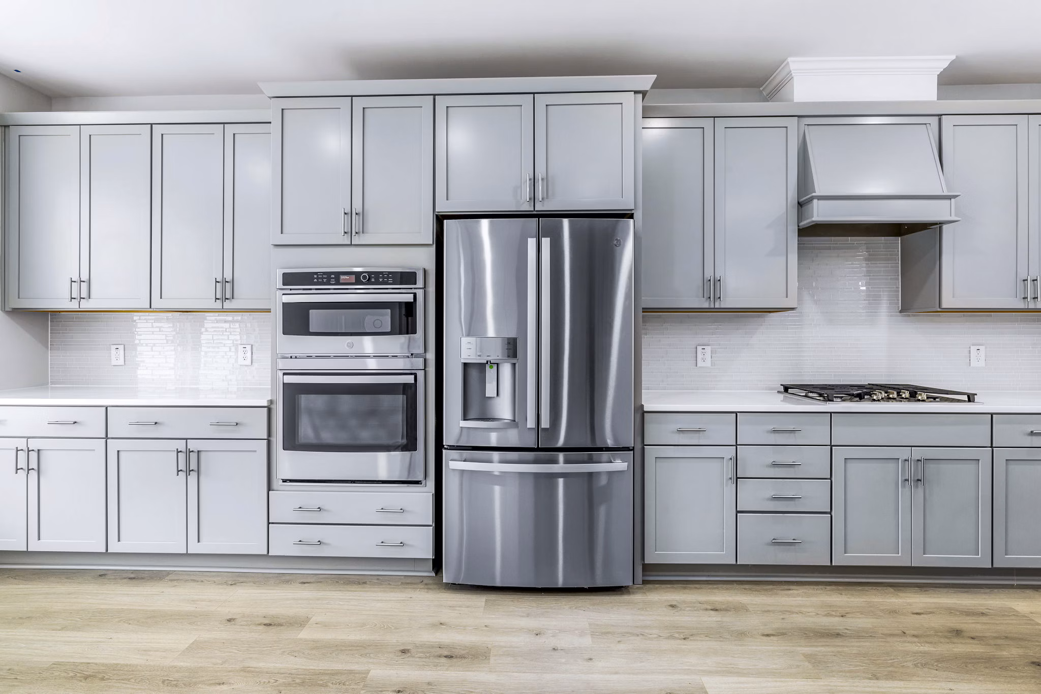 Modern kitchen with stainless steel appliances at Abode Kerr Ridge Apartments, a luxury living option by Greystar