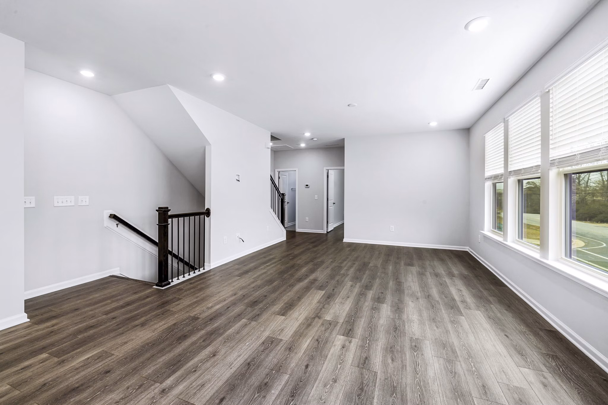 Stairway leading to a modern living room at Abode Kerr Ridge Apartments, luxury apartments by Greystar in a prime location