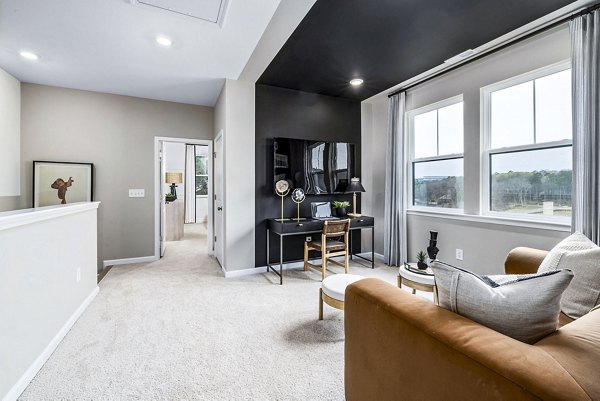 Living room with modern decor and open layout at Abode Kerr Ridge Apartments