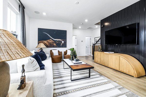 Spacious living room with modern decor at Abode Kerr Ridge Apartments