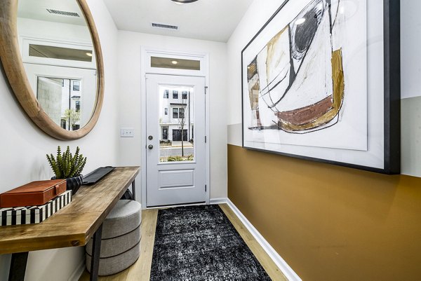 Welcoming entry hallway with modern decor at Abode Kerr Ridge Apartments luxury townhomes