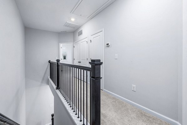 hallway/stairway to bedrooms at Abode Kerr Ridge Apartments