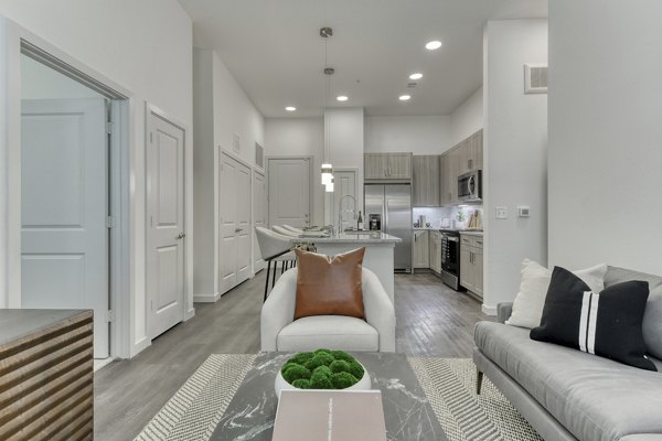 Spacious living room with modern decor at Park at Stone Oak Apartments