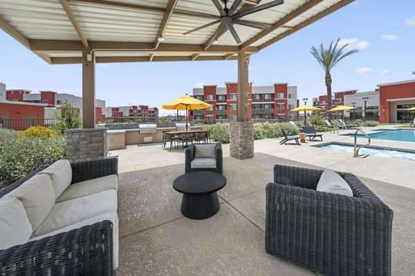 Charming outdoor patio with cozy seating at Prose at Ballpark Village Apartments, ideal for relaxation and social gatherings