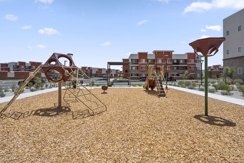 Modern playground at Prose at Ballpark Village Apartments offering fun outdoor activities for residents