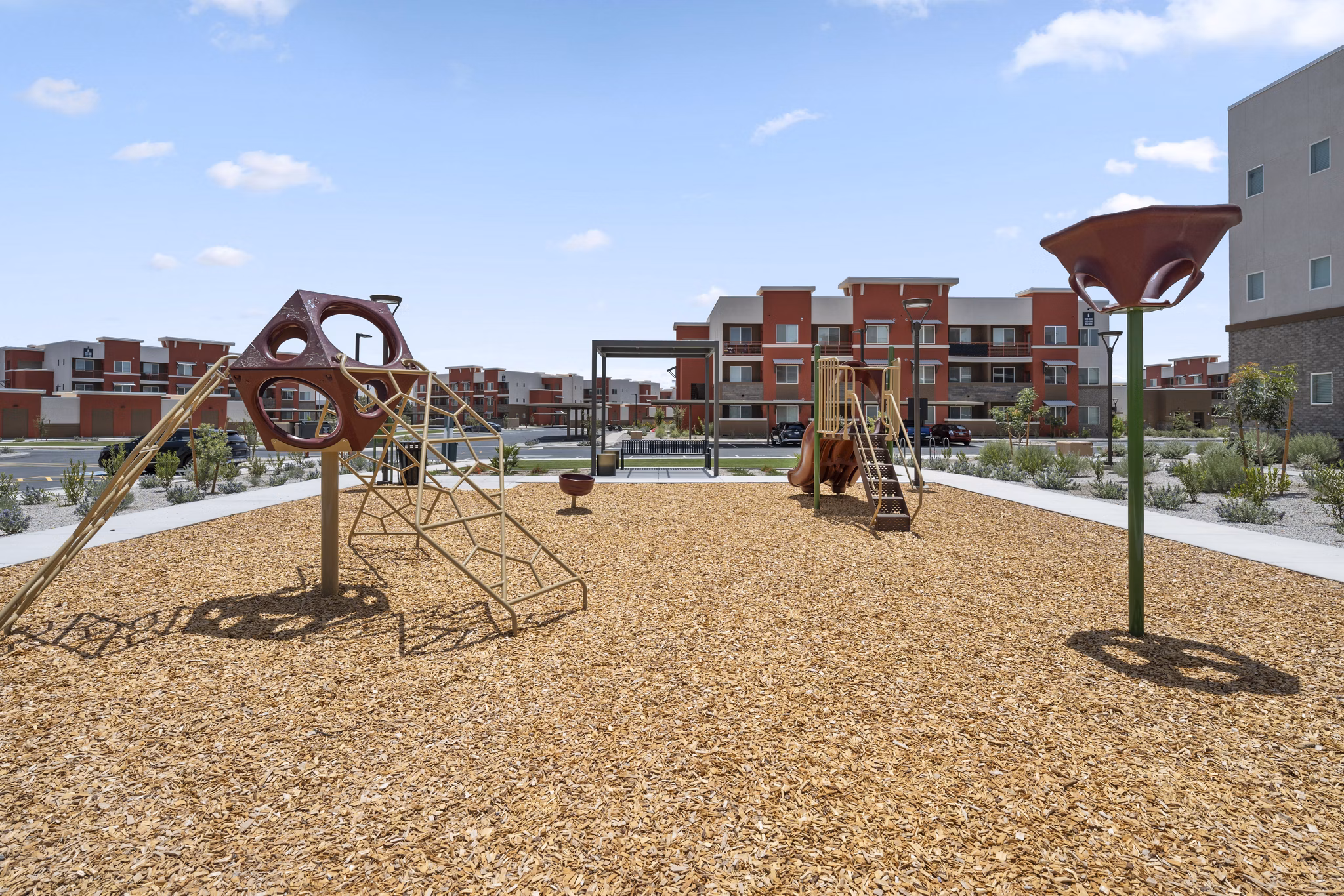 Modern playground at Prose at Ballpark Village Apartments offering fun outdoor activities for residents