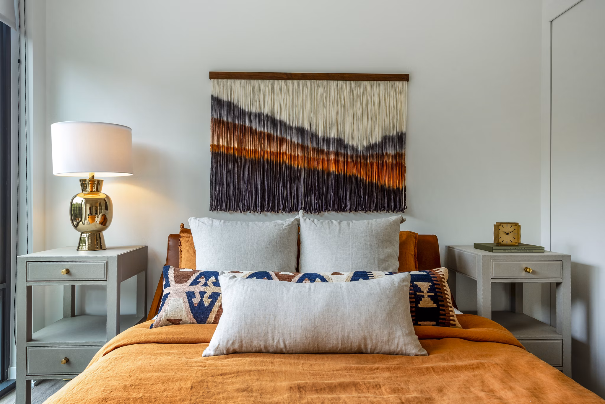 Cozy bedroom with a stylish bed and modern decor in luxury apartments